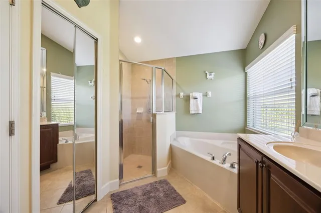 a bathroom with a sink double vanity and shower