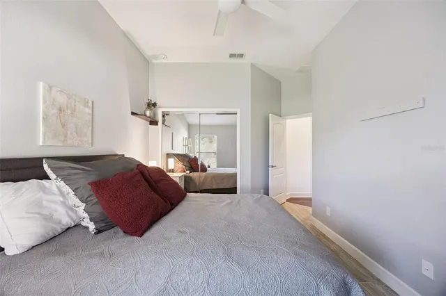 a living room with furniture a large window and a chandelier