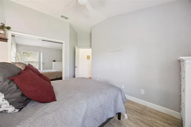 a view of a patio with a table chairs and a backyard