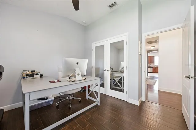 a view of a house with a yard and sitting area