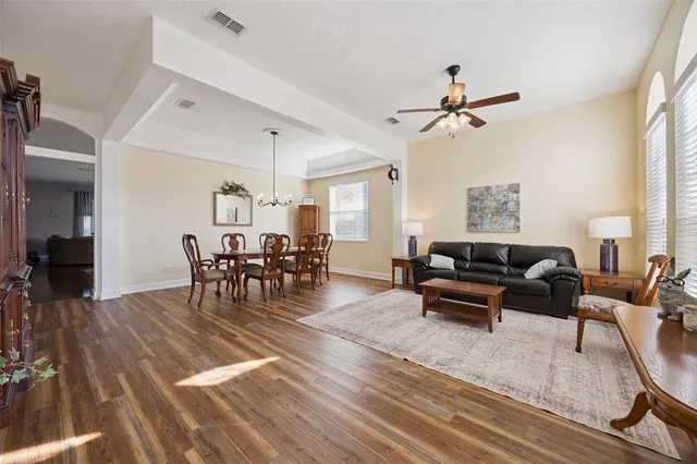 a view of a dining room with furniture window and wooden floor