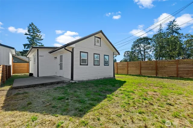 a house view with a garden space
