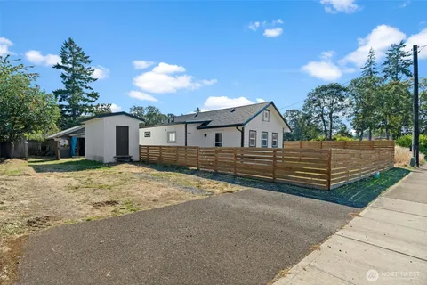 a view of house with wooden fence