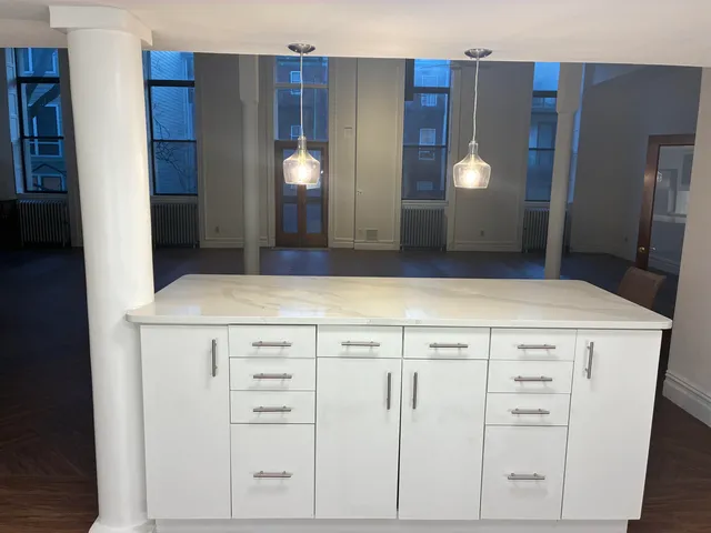 a view of cabinets with wooden floor