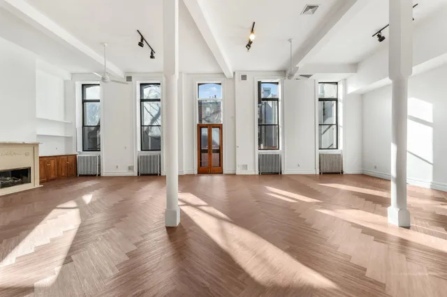 a view of a livingroom with furniture and window