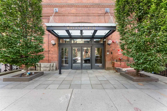 a view of a patio with table and chairs and potted plants