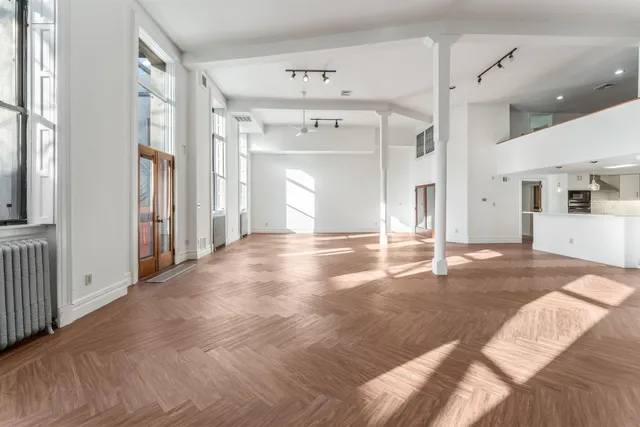 a view of a bathroom with a tub shower and closet