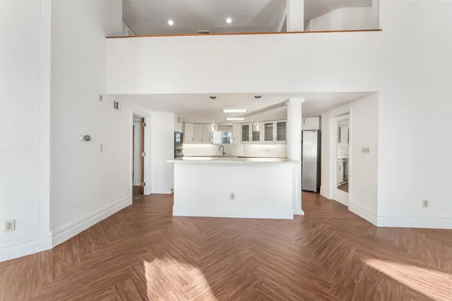 a view of kitchen with wooden floor