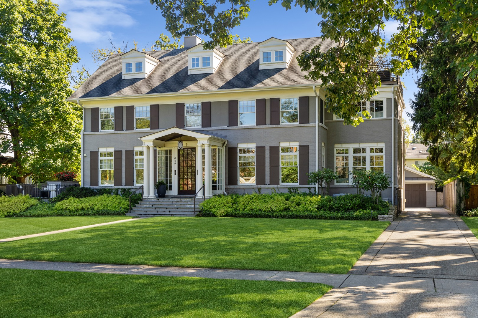 819 Chestnut Avenue Wilmette, IL 60091 - Photo 90 of 100 a front view of a house with a yard