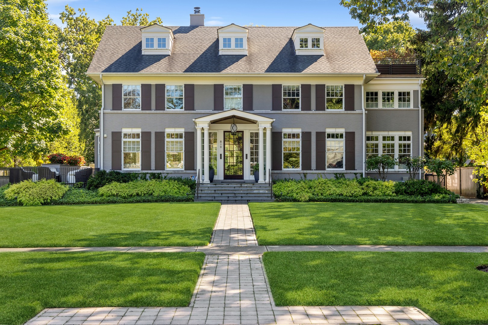 819 Chestnut Avenue Wilmette, IL 60091 - Photo 98 of 100 a front view of a house with a yard