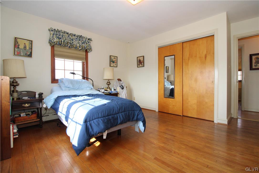 111 Hillendale Avenue Nazareth, PA 18064 - Photo 11 of 29 a bedroom with a bed and wooden floor