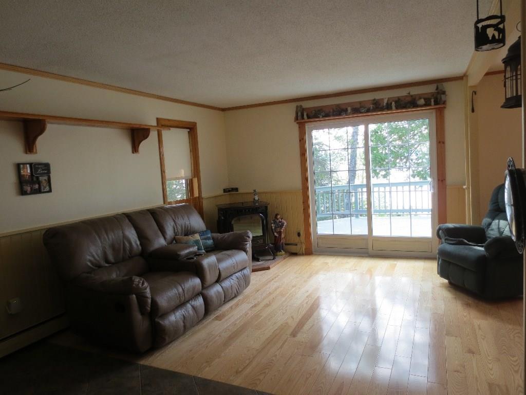 219 South Shore Road Stockholm, ME 04783 - Photo 7 of 32 Large Living Room With Sliding Door...