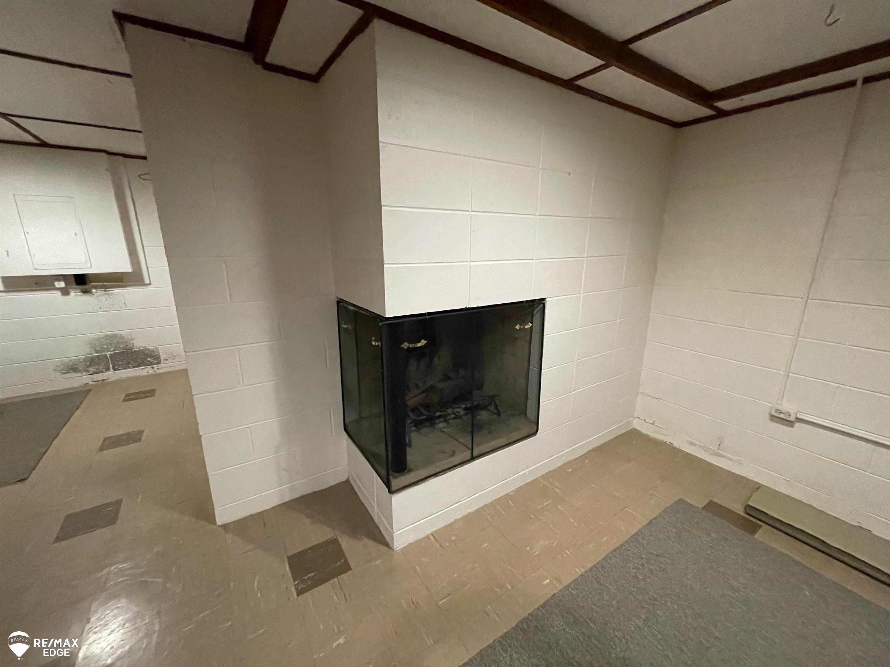 8047 North Seymour Road Flushing, MI 48433 - Photo 29 of 47 Basement Fireplace