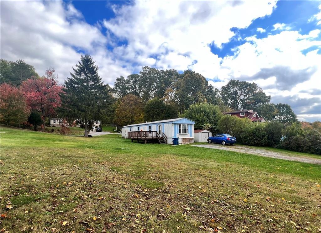 518 Gardner Road New Castle, PA 16101 - Photo 2 of 10 a view of a house with a big yard and a large trees