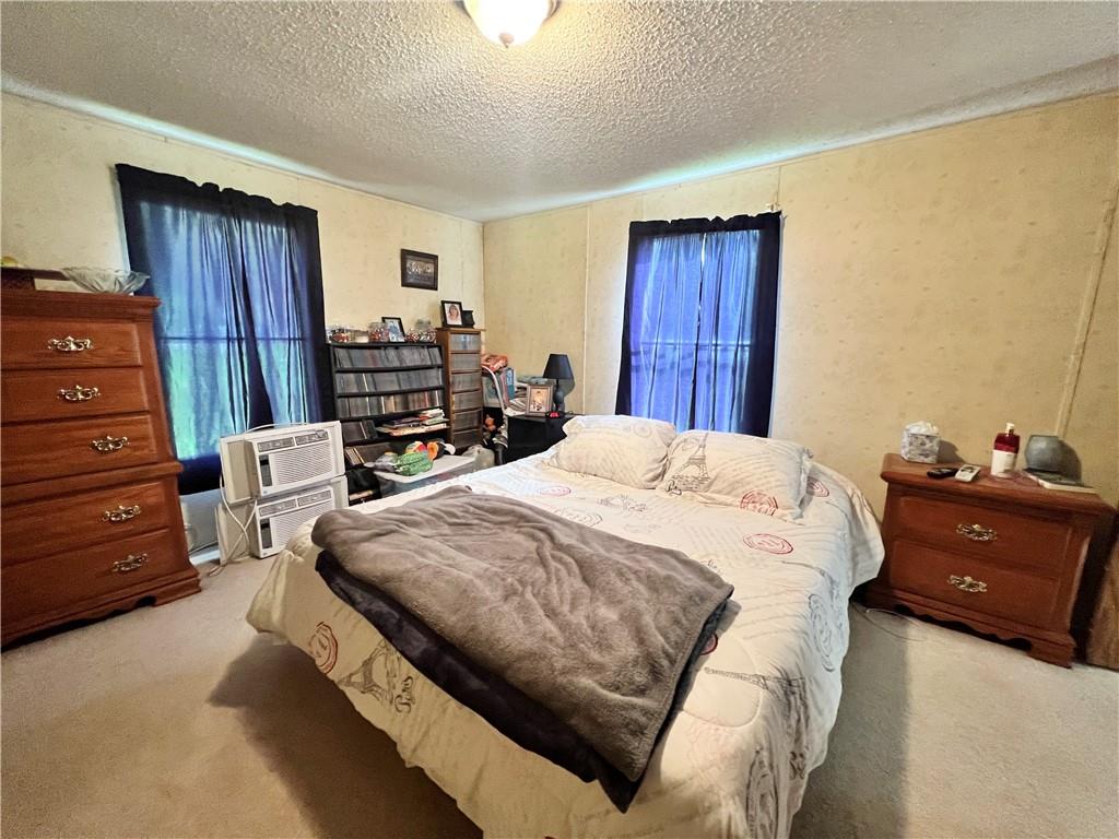 518 Gardner Road New Castle, PA 16101 - Photo 6 of 10 a bedroom with a bed and wooden floor