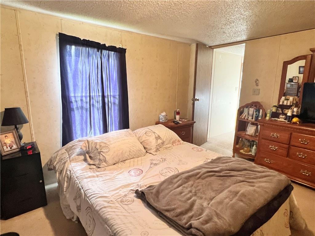 518 Gardner Road New Castle, PA 16101 - Photo 7 of 10 a bedroom with a bed and a dresser in it