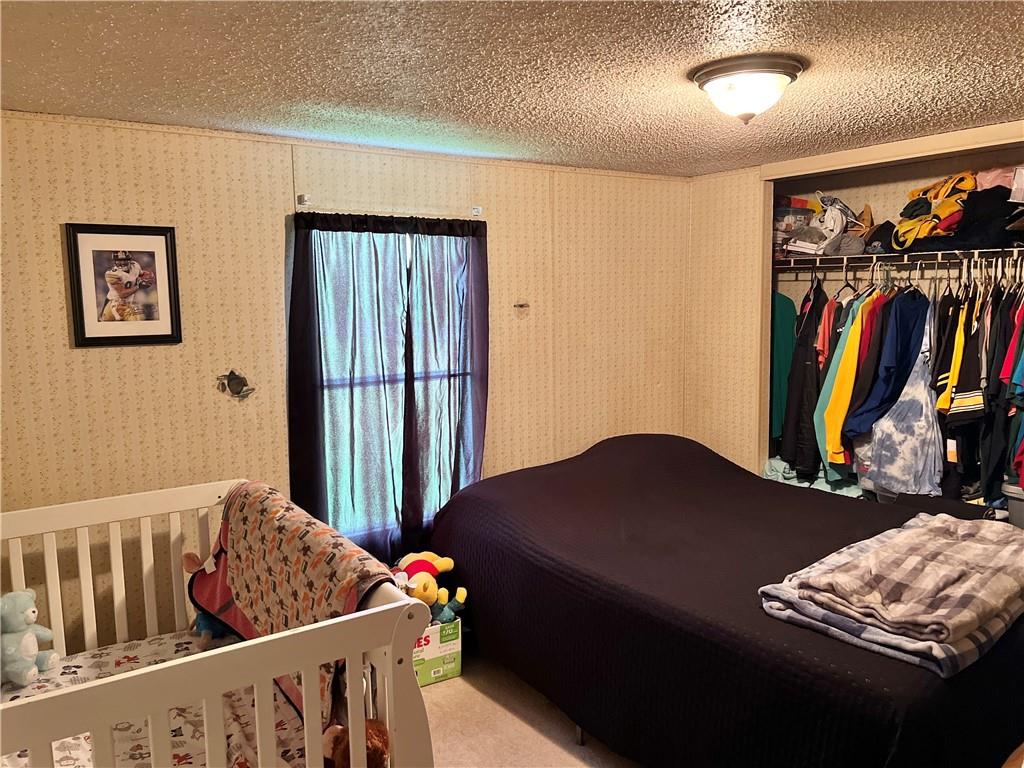 518 Gardner Road New Castle, PA 16101 - Photo 9 of 10 a bedroom with furniture and a window