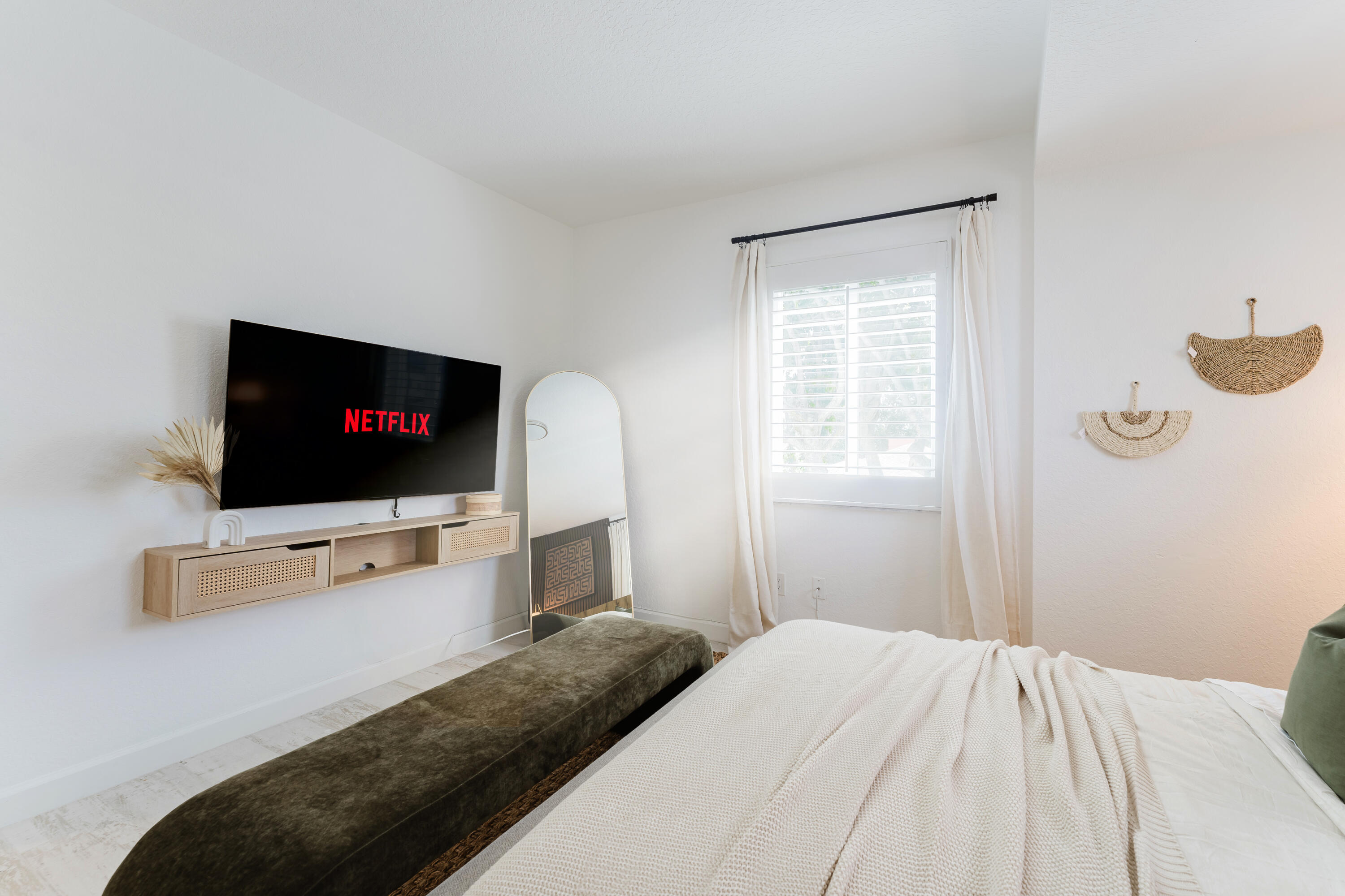 921 Ortega Road West Palm Beach, FL 33405 - Photo 20 of 60 a bedroom with a bed and a flat screen tv