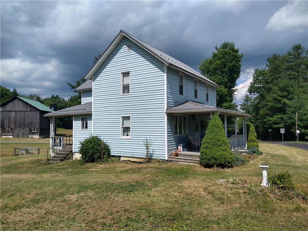 2612 Canoe Ridge Road Rossiter, PA 15772 - Photo 15 of 28 a view of a house with a yard and plants
