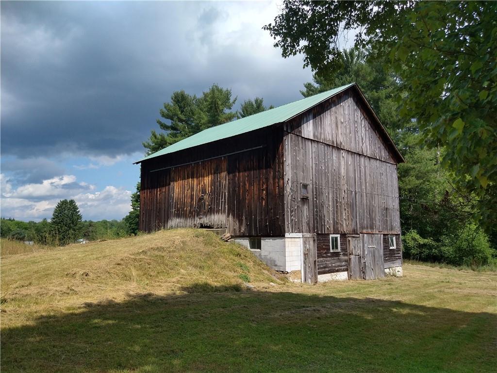 2612 Canoe Ridge Road Rossiter, PA 15772 - Photo 21 of 28 a backyard of a house with wooden fence and large trees