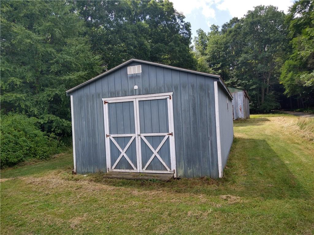 2612 Canoe Ridge Road Rossiter, PA 15772 - Photo 24 of 28 a house with trees in front of it