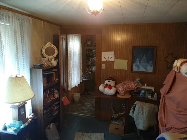 a bed room with furniture and a window