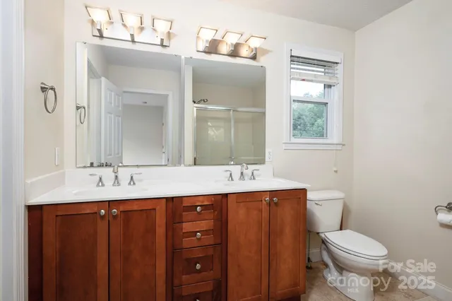 a bathroom with a glass shower door