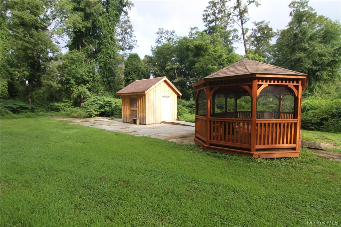 71 Miller Road, Unit 6 Hopewell Junction, NY 12533 - Photo 27 of 28 View of yard featuring a storage unit and a gazebo