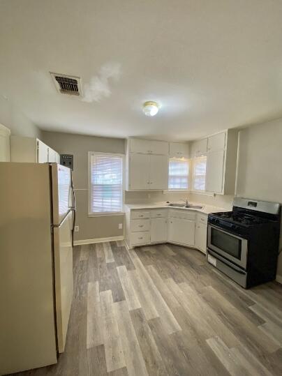 2805 37th Street Lubbock, TX 79413 - Photo 4 of 11 a kitchen with stainless steel appliances a refrigerator and a stove