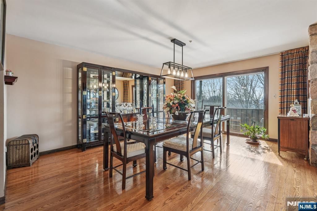845 Rifle Camp Road Woodland Park, NJ 07424 - Photo 14 of 50 a view of a dining room with furniture window and wooden floor