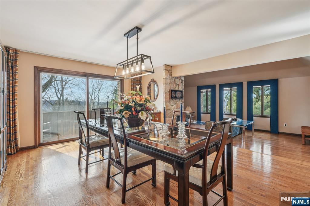 845 Rifle Camp Road Woodland Park, NJ 07424 - Photo 15 of 50 a view of a dining room with furniture window and wooden floor