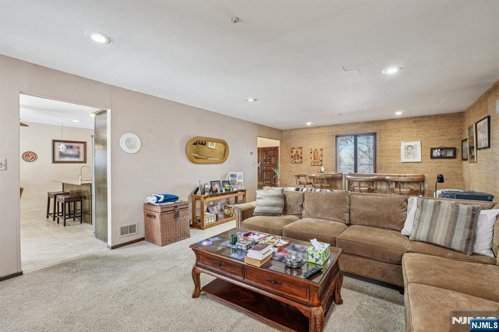 845 Rifle Camp Road Woodland Park, NJ 07424 - Photo 19 of 50 a living room with furniture and a table