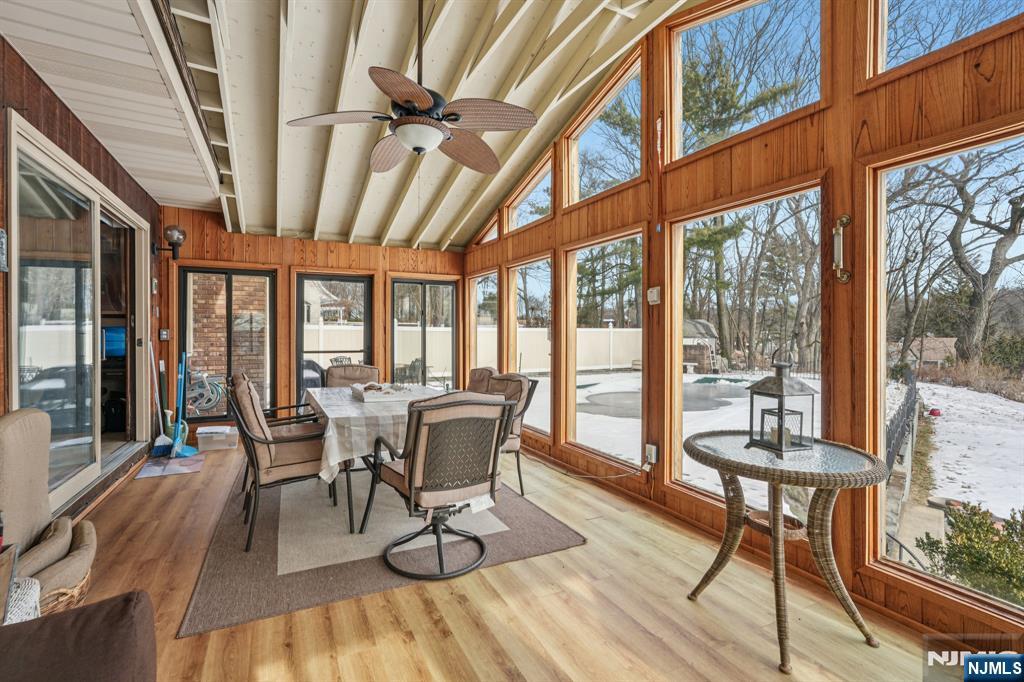 845 Rifle Camp Road Woodland Park, NJ 07424 - Photo 23 of 50 a view of a dining room with furniture window and wooden floor