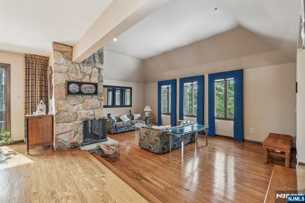 845 Rifle Camp Road Woodland Park, NJ 07424 - Photo 3 of 50 a living room with furniture large window and wooden floor