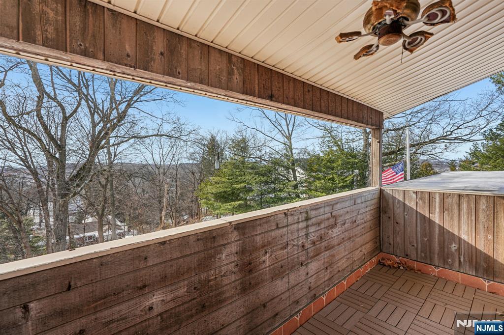 845 Rifle Camp Road Woodland Park, NJ 07424 - Photo 31 of 50 a view of balcony with wooden floor