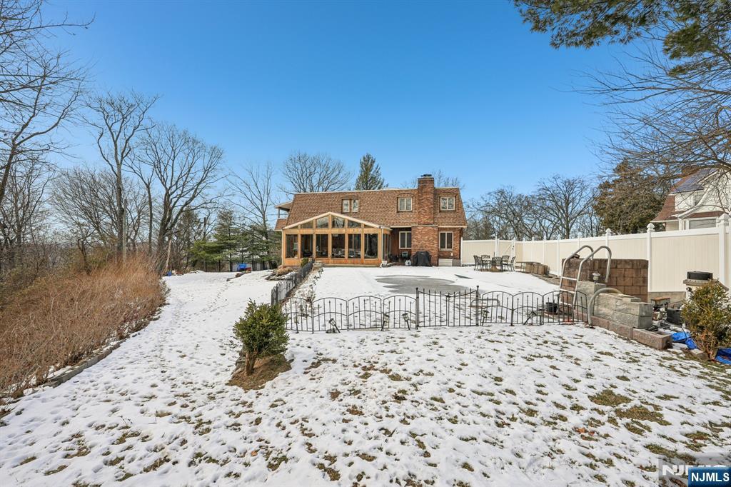 845 Rifle Camp Road Woodland Park, NJ 07424 - Photo 44 of 50 a white house with a large tree in front of it