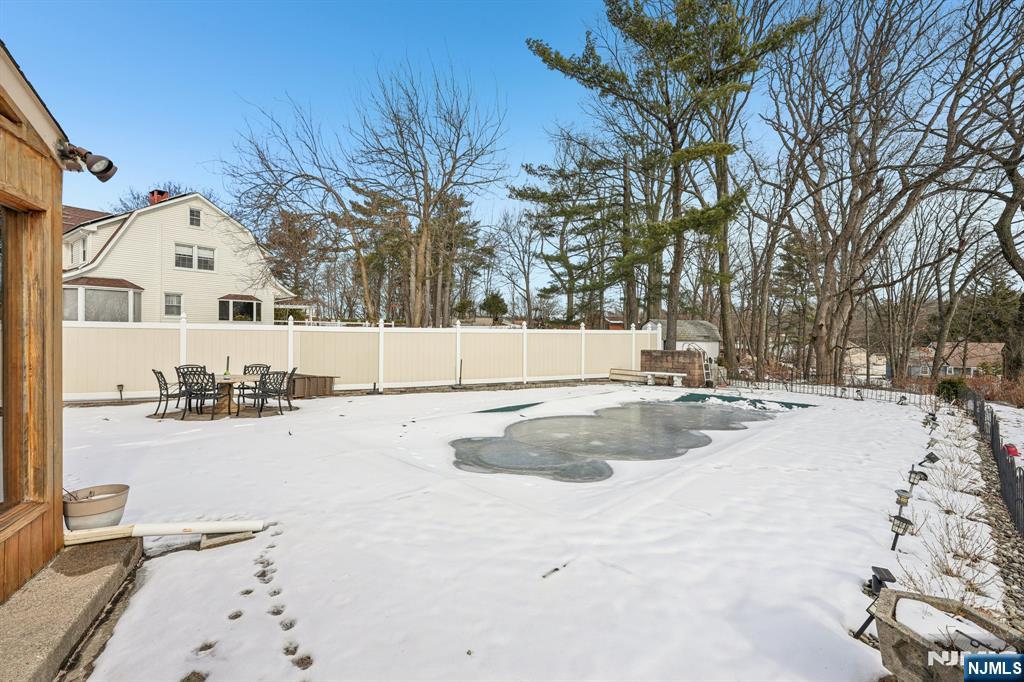 845 Rifle Camp Road Woodland Park, NJ 07424 - Photo 47 of 50 a view of a yard with snow on the road