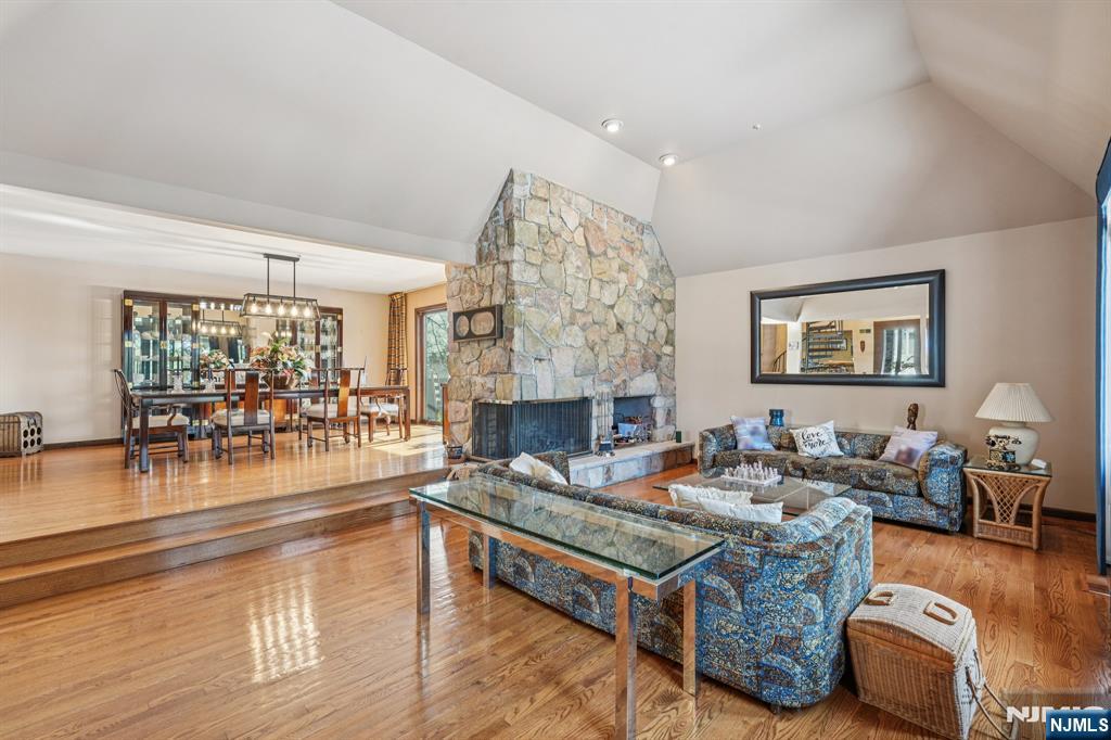 845 Rifle Camp Road Woodland Park, NJ 07424 - Photo 6 of 50 a living room with furniture and a fireplace