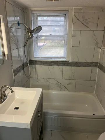 a bathroom with a sink and a shower