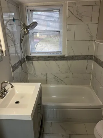 a bathroom with a sink and a bathtub