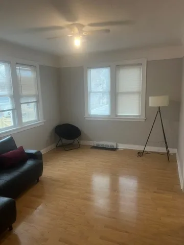 a living room with a couch and a window