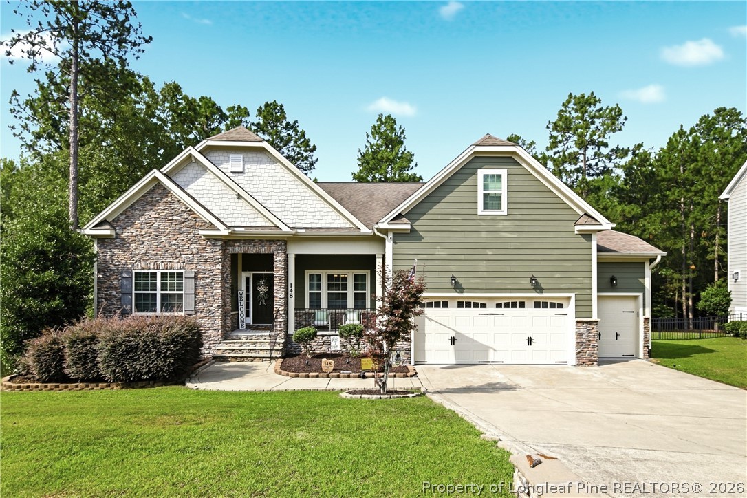 148 Heatherspring Way Spring Lake, NC 28390 - Photo 1 of 50 a view of a house with a yard and sitting area