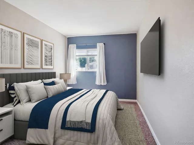 a bedroom with bed and a window