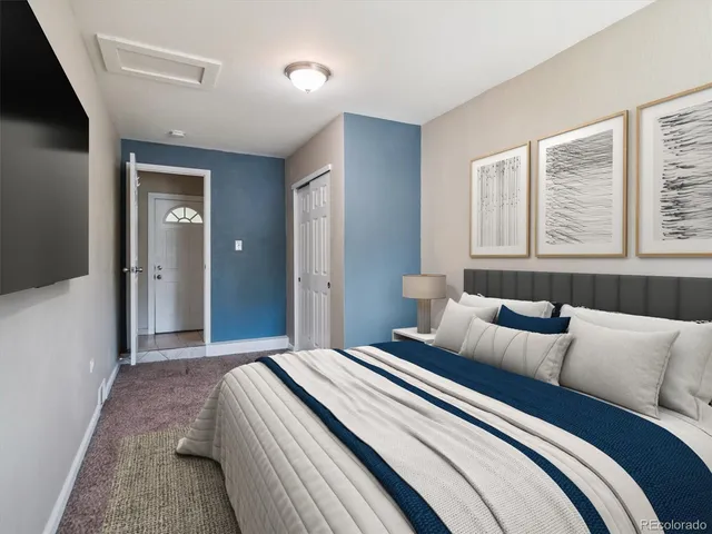 a bedroom with bed and window