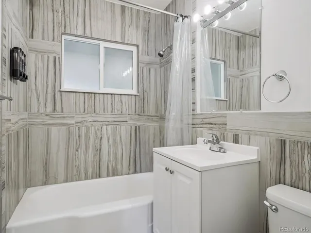 a bathroom with a sink a toilet and a bathtub
