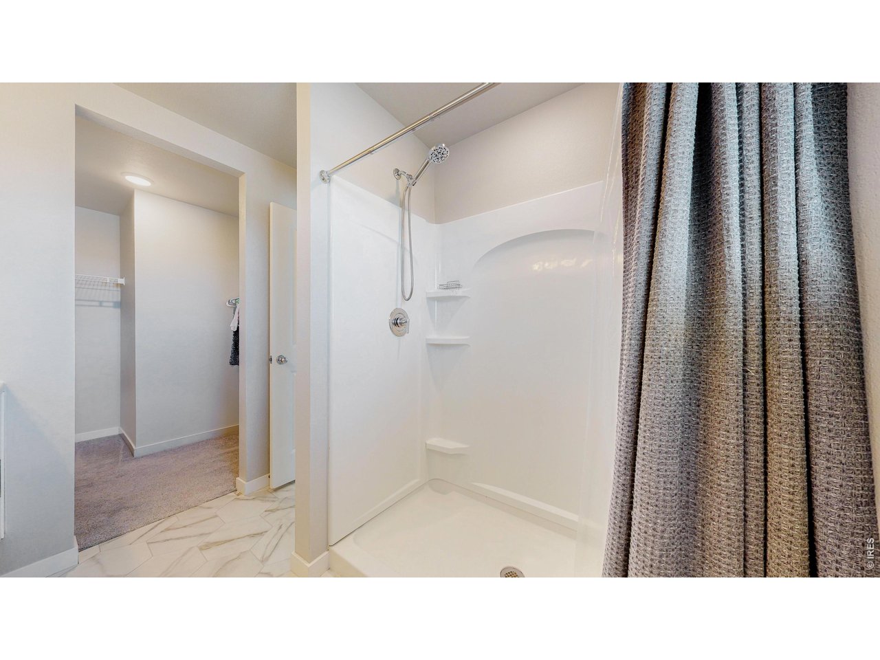 260 Pawnee Road, Unit D3 Ault, CO 80610 - Photo 23 of 44 primary bathroom with walk-in closet.