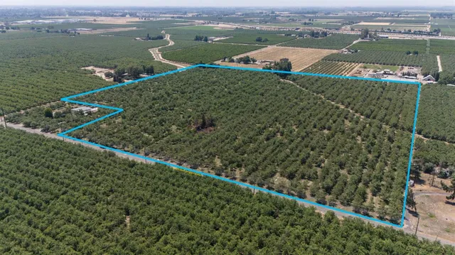an aerial view of a houses with a lake view
