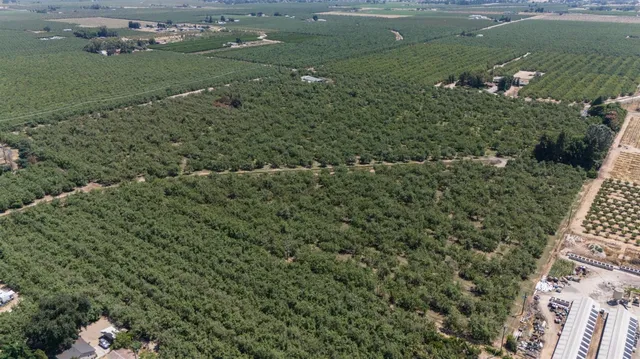 an aerial view of a houses with outdoor space