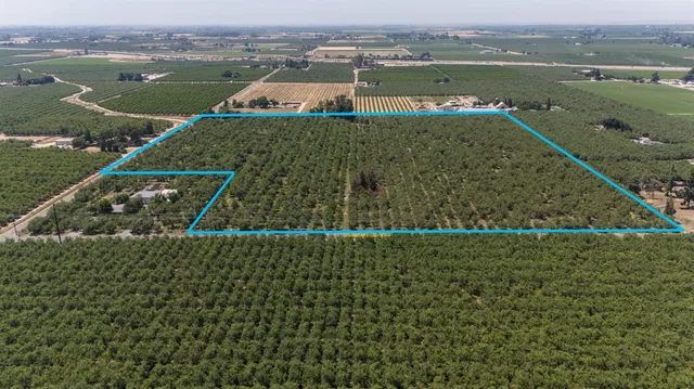 an aerial view of a houses with a lake view
