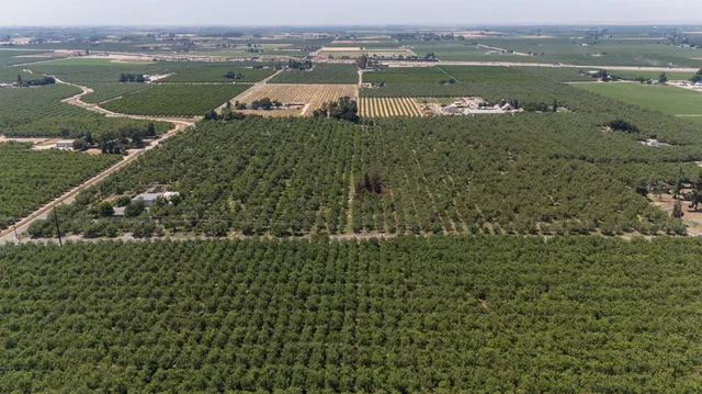 an aerial view of a houses with a lake view